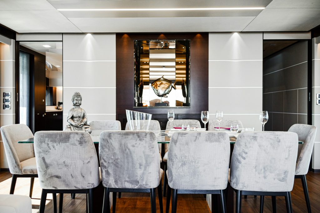 Superyacht dining room interior with upholstered chairs